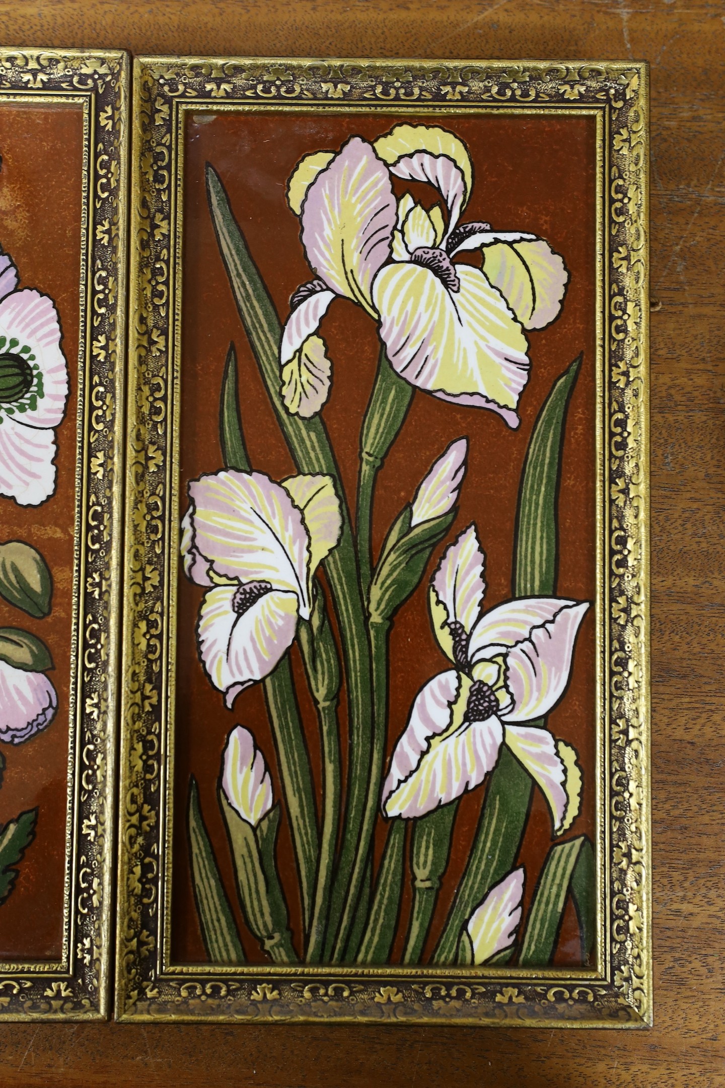 A pair of late 19th century Aesthetic pottery tile panels, 33 x 18cm